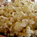 Very close up photo of popped corn (popcorn).